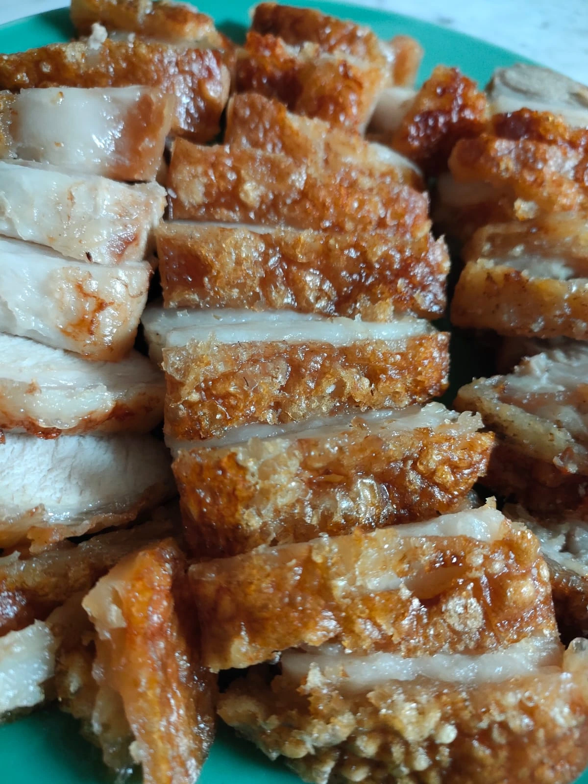 Golden crispy pork belly (babi panggang krispi) with perfect crackling skin